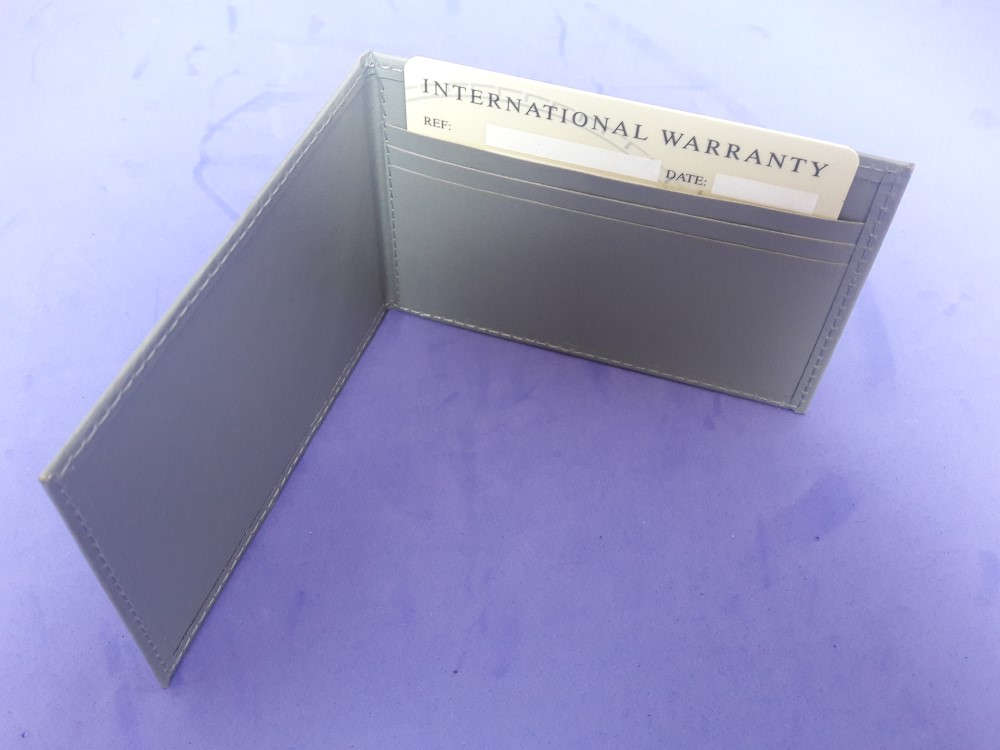 OMEGA INTERNATIONAL GUARANTEE WARRANTY CARD NEW, BLANK + CARD HOLDER